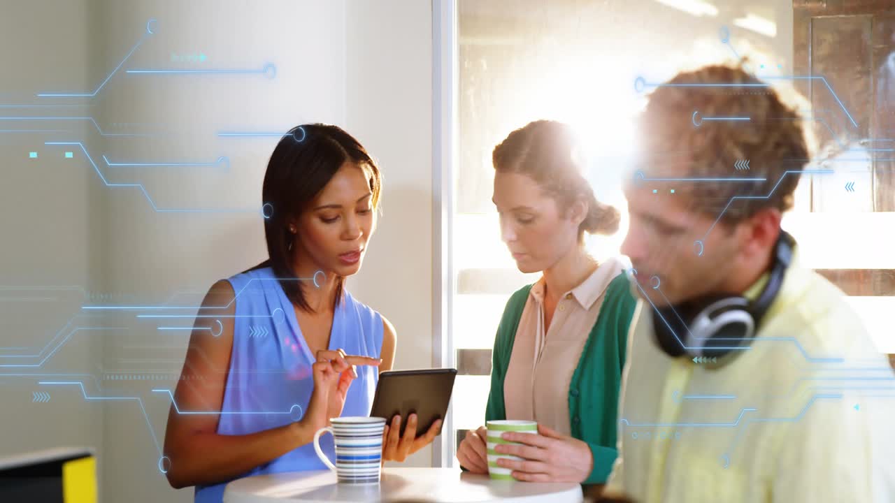 Woman tapping tablet and showing tech at round table, team watching as circuit graphic animating