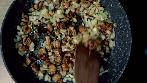 spicing up chinese veggies with soy sauce and tossing in a frying pan