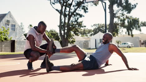 athlete receiving assistance on a basketball court