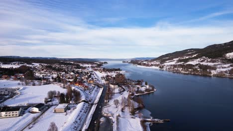 panoramic view of the promenade of a small river and ski resort town