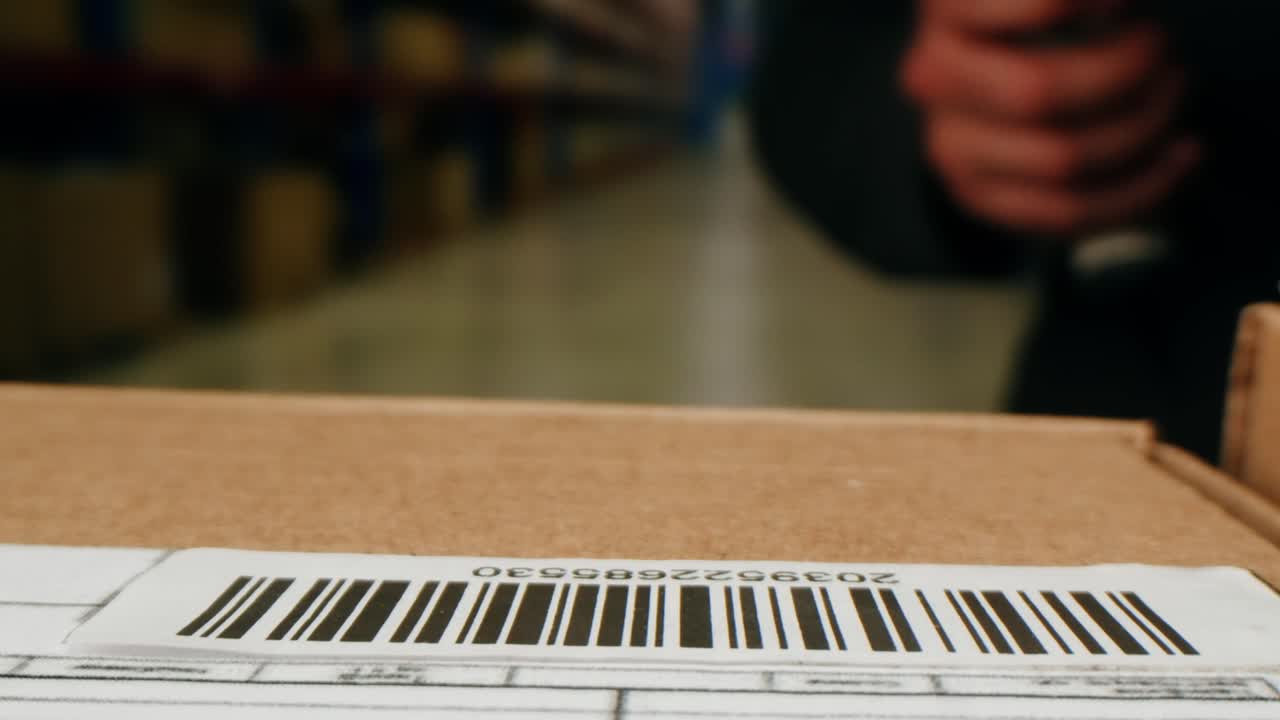 Scanner scan delivery box in storage, E-commerce shop, man packing goods and clothes second hand delivery market, courier Packaging and Shipping Workspace with Supplies and Technology, online sales.