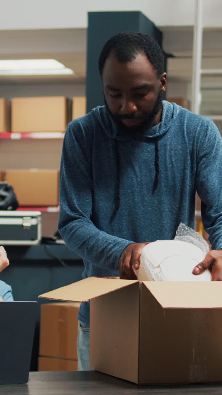 Vertical video: Entrepreneurs team preparing shipment order with products
