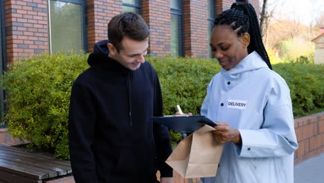 Delivery-girl-with-paper-bags-and-a-clipboard