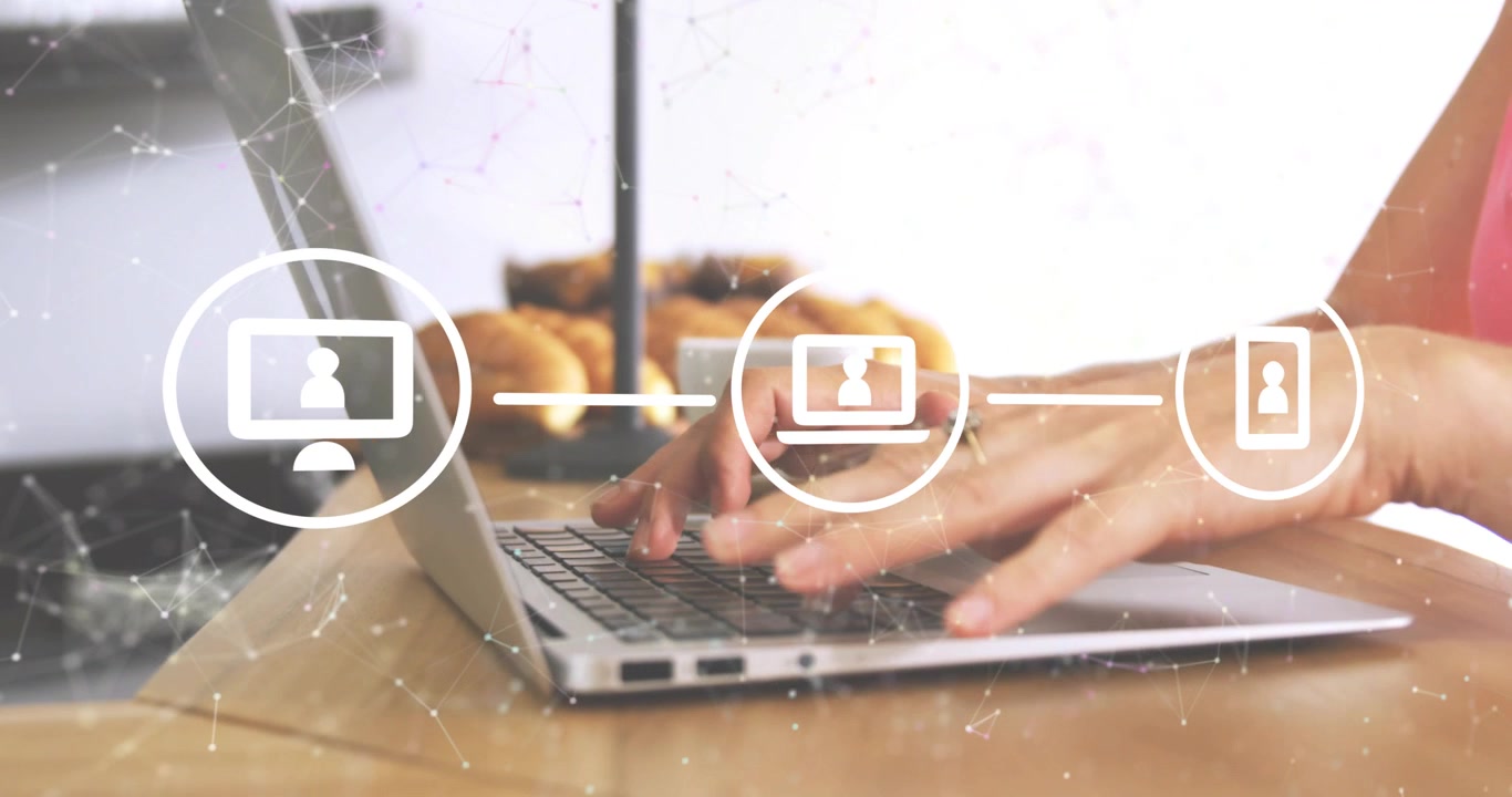 Monitor icon fading linking desktop laptop smartphone icons while hands typing showing network flow