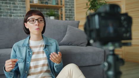 woman vlogger recording video at home