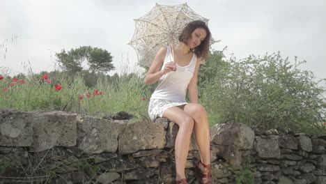 young woman outdoors in the countryside relaxing