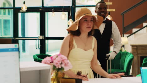 tourist entering tropical hotel lobby