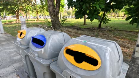 sequence of a bottle being thrown into a recycling bin