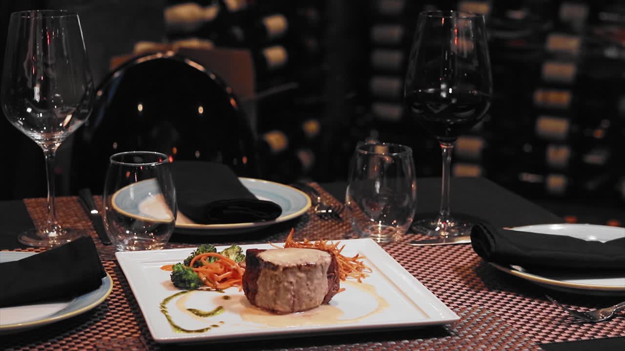 Wide Angel dish of filet of mignon with broccoli and hash browns on white plate