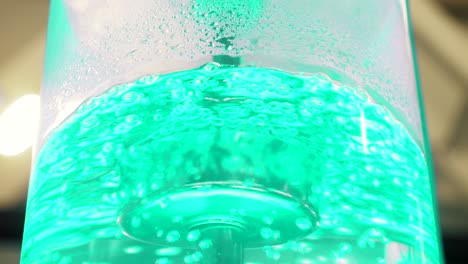 close-up of a green fizzy drink dispenser