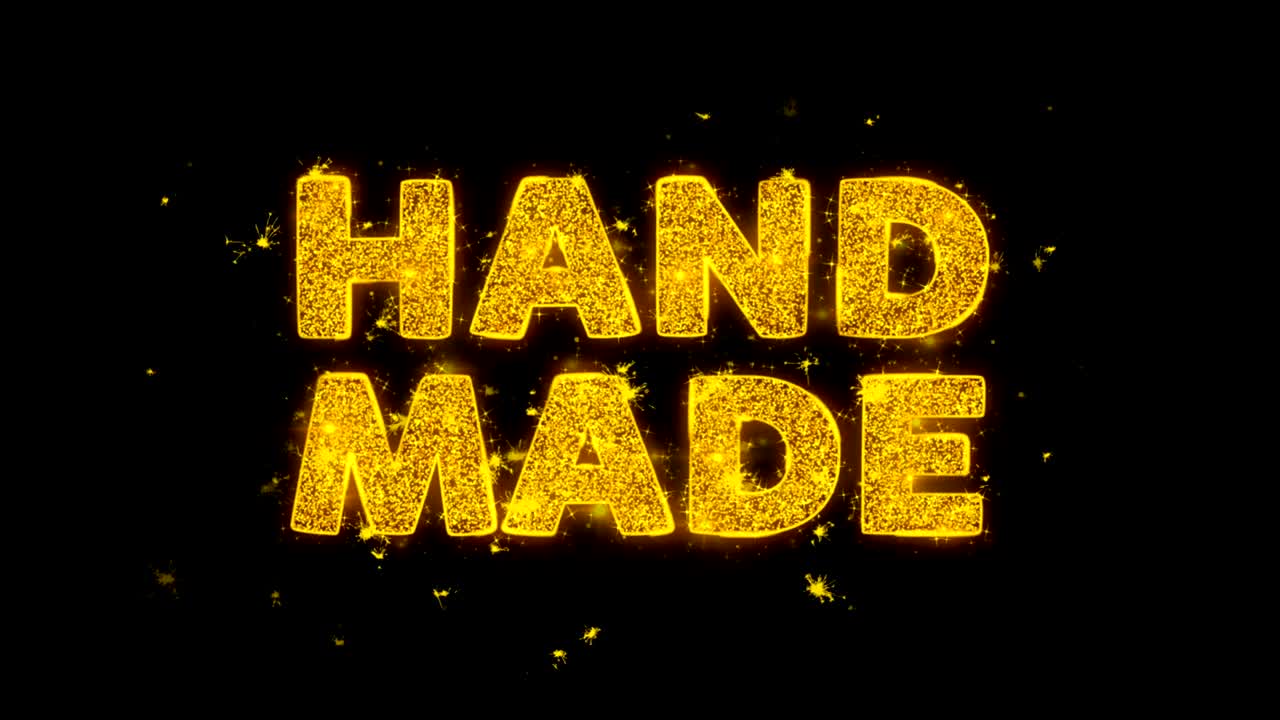 Hand Made Text Sparks Particles on Black Background.