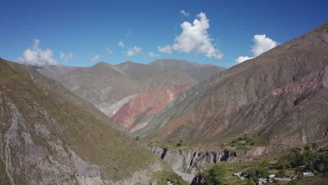 Forward-aerial-of-mountains-by-Iruya-in-sunny-rural-Salta,-Argentina