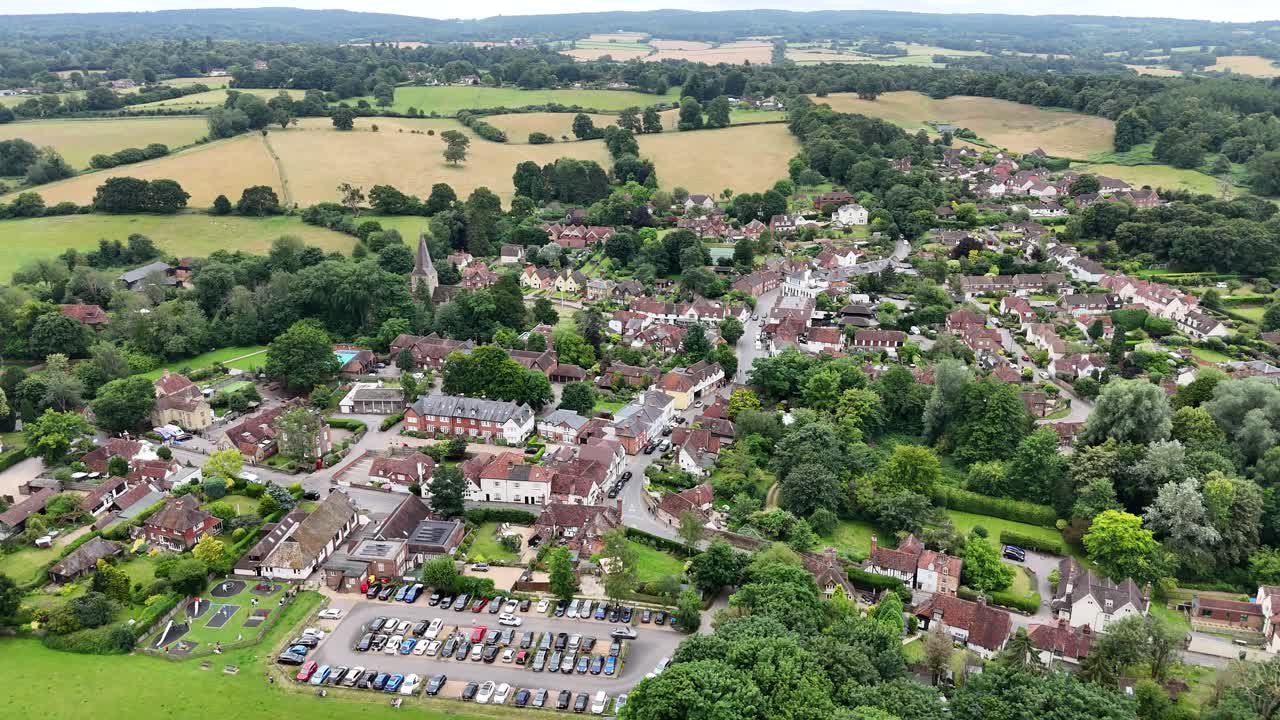 Panning drone aerial Shere Surrey UK quaint English Village