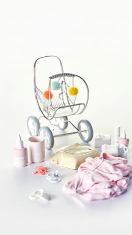 assortment of baby care products and miniature stroller