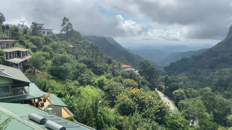 establishing handheld shot looking down ella gap on cloudy morning in sri lanka