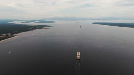 several large cargo ships sail in the atlantic ocean