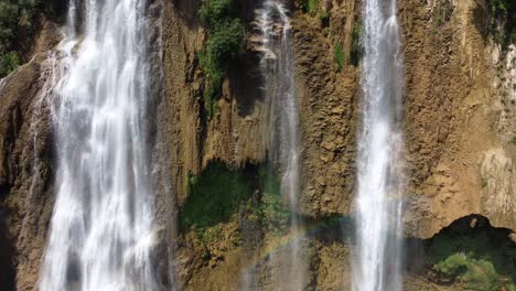 a nice and scenic close up 4k drone shot of one of the small waterfalls of thi lo su waterfall in the jungle landscape of north thailand, located in the area of umphang in asia