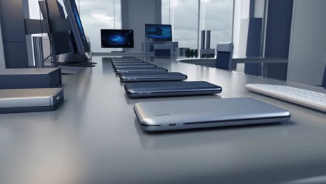 modern office workspace with multiple laptops
