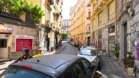 a bustling street with cars and pedestrians