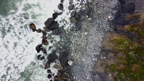 4k 30fps aerial footage oregon coast - waves crashing against the rocky moss shore, turquoise blue water, foamy water, contrast- top down shot of pacific ocean shore in south oregon - dji drone video