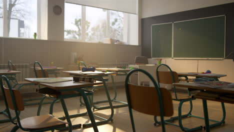 Classroom-at-school-campus.-Wooden-desks-and-chairs-in-private-school-auditorium