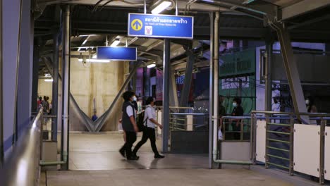 skywalk connecting the sky train station on the main road in lat phrao area, bangkok, thailand