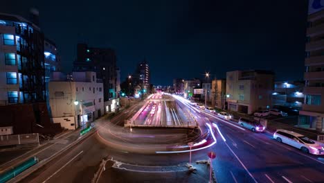 a night timelapse of the traffic jam at the city street in tokyo wide shot