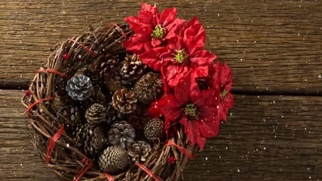 falling snow with christmas decorations on wood