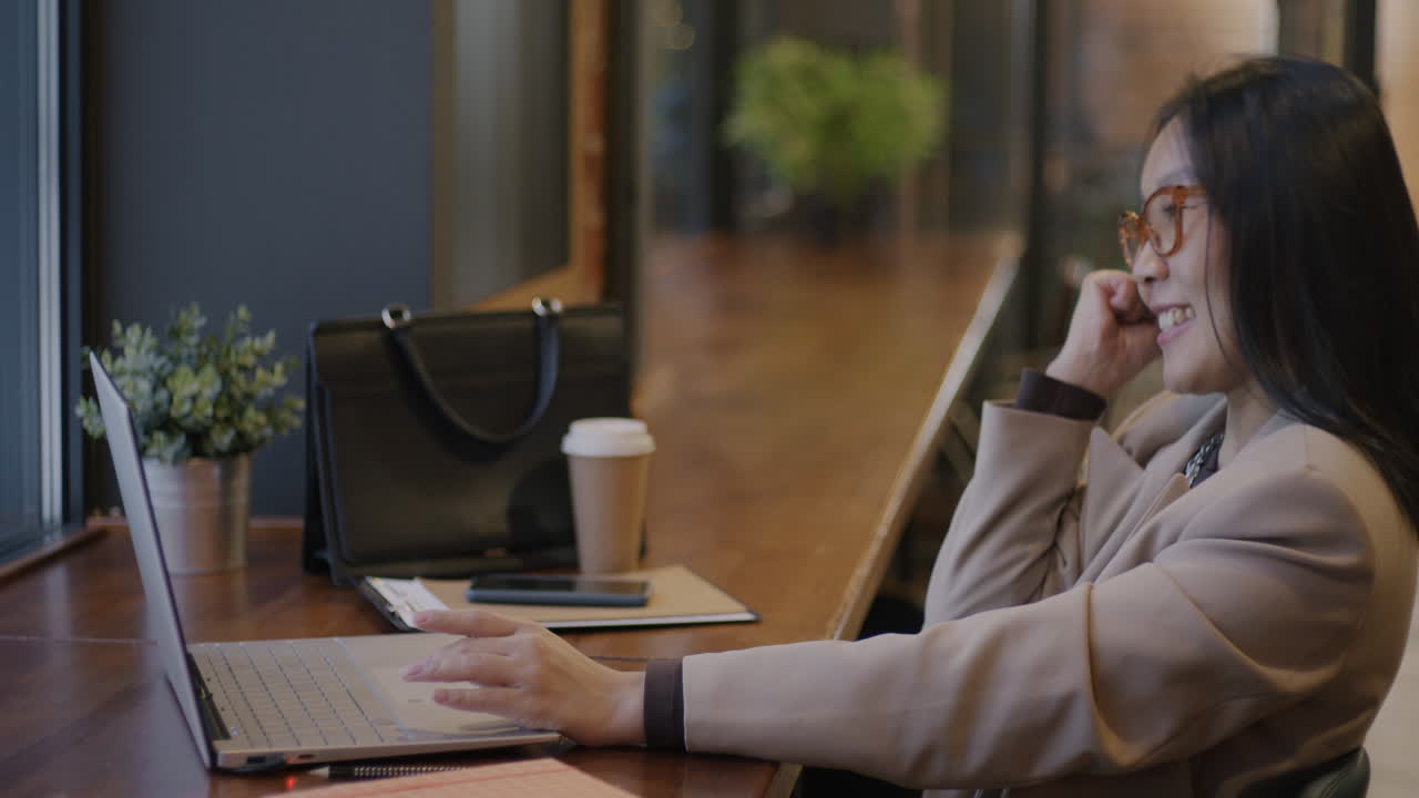 Business Woman Working in a Cafe