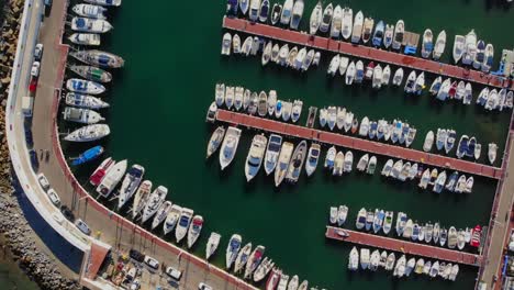 Drone-footage-flying-over-the-marina-in-Marbella,-Spain