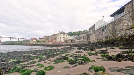 scenic view of rocky beach and buildings