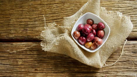 cherries in a bowl on a textile 4k