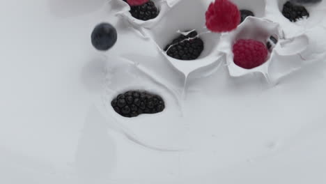 tasty berries dropped yogurt in super slow motion close up. healthy vitamin food