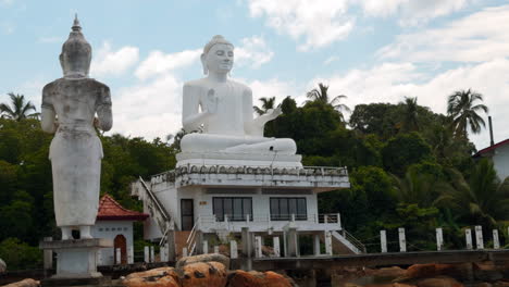 large white buddha statue at a temple in sri lanka