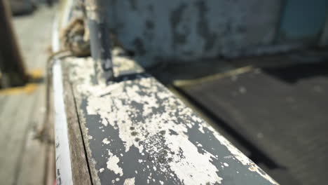 aged paint - wooden old boat peeling texture surface - tracking shot, slow motion