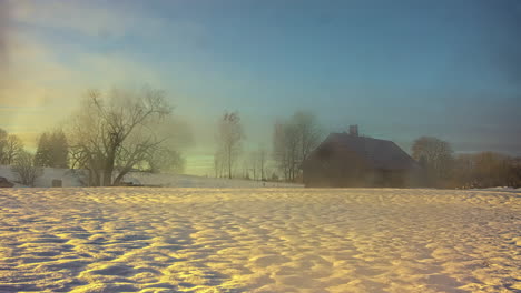 Early-morning-sunrise-sunset-field-covered-snow-trees-moving-clouds-time-lapse