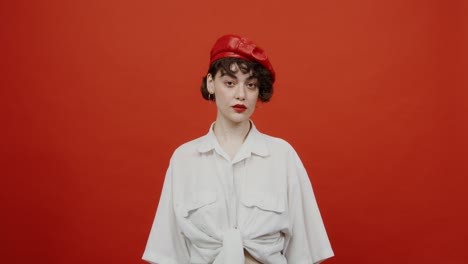 woman in red beret and white shirt