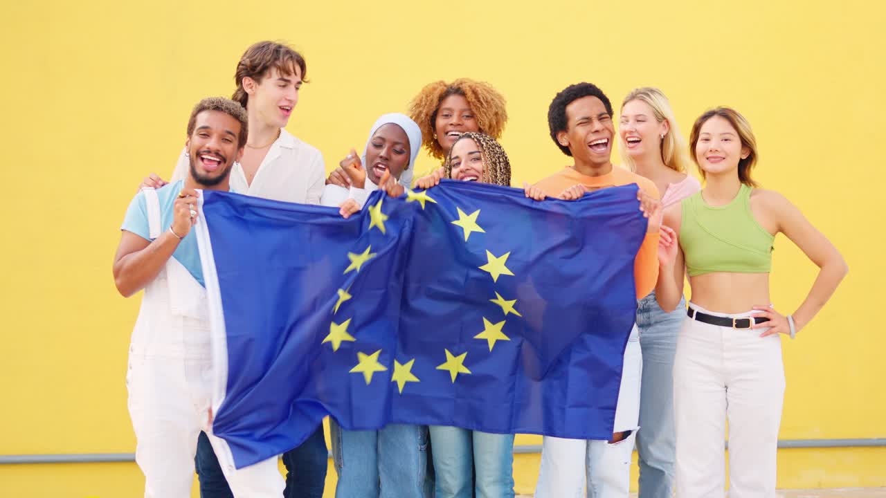 Group of young people holding EU flag