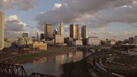 aerial view over the river heading towards a major city.