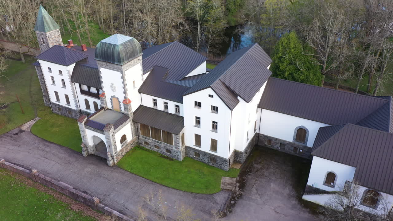 Beautiful manor of Jungulbene in Latvia, aerial orbit view