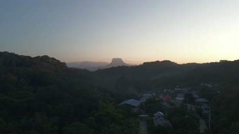 Aerial-over-mountain-village-in-Mexico-countryside,-latin-america-dense-forest