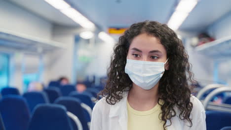 woman wearing a mask on a train