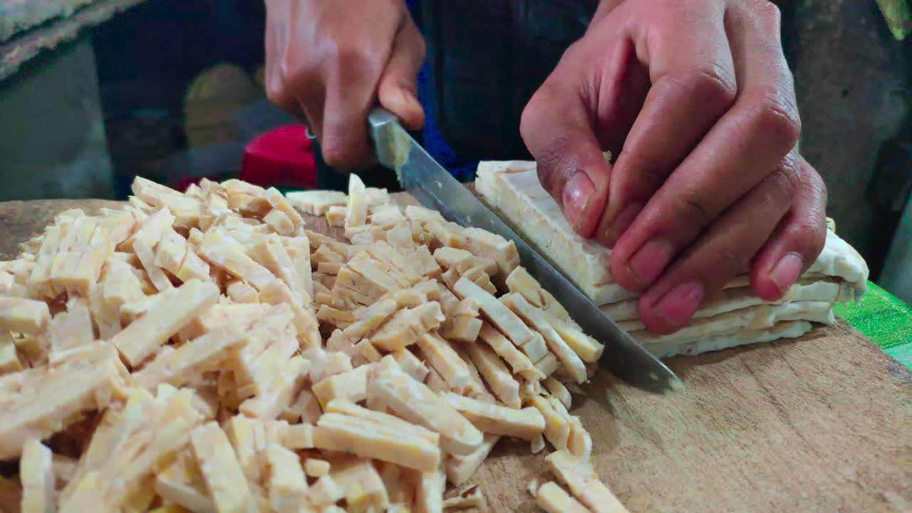 Preparing tempe, a traditional staple delicacy made from soybean that is cheap to find in Indonesia