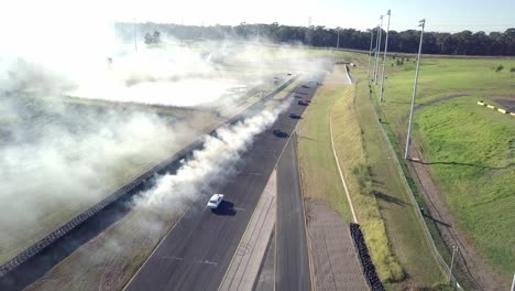 sports cars drag racing at sydney motorsport park in eastern creek, new south wales, australia - aerial drone shot