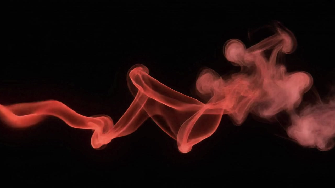 Fumo rosso su uno sfondo nero