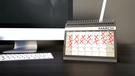 ticking off dates and months on desk year calendar. counting down days, fliping pages. achieving targets goals.