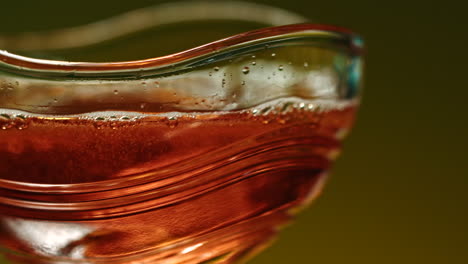 close-up of a decorative glass with a red drink