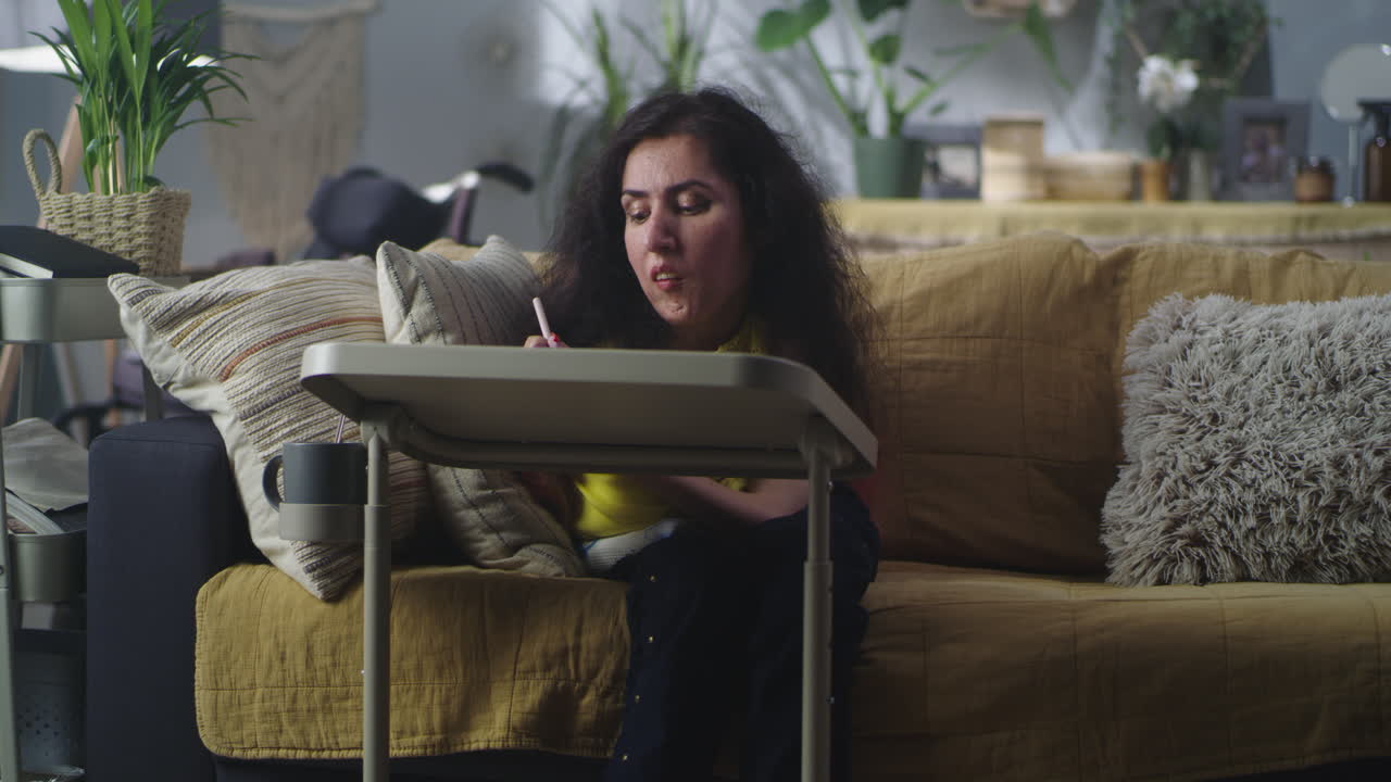 Woman with a Disability Drawing on Camera