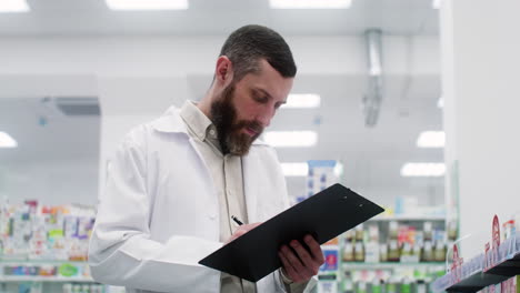 mature man writing on a clipboard