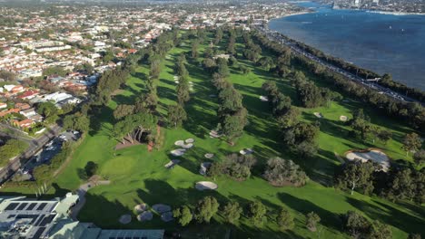 Overhead-shot-of-the-golf-course-of-Royal-Perth-Golf-Club-in-Perth-City,-Western-Australia,-aerial-dynamic-tilting-downward